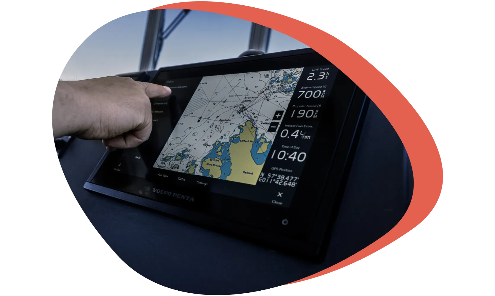 Hand pointing at the Volvo Penta Glass Cockpit navigation display
